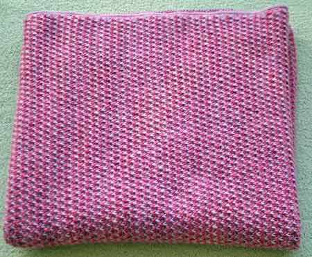Isabella's blanket using Malabrigo merino yarn, shocking pink & orchid