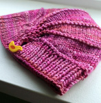 Knitted hat, Malabrigo Arroyo Yarn, color 57 english rose