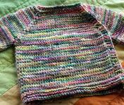 handknit raglan baby sweater; Malabrigo Silky Merino Yarn, color 866 arco iris
