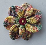 handknit flower; Malabrigo Silky Merino Yarn, color 866 arco iris
