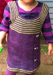 hand knit child's dress; Malabrigo Silky Merino Yarn color blackberry