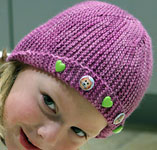 hand knit child's garter stitch hat; Malabrigo Silky Merino Yarn color plum blossom