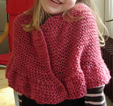 handknit child's poncho; Malabrigo Silky Merino Yarn, color 401 raspberry