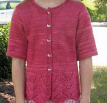 handknit child's long cardigan sweater; Malabrigo Silky Merino Yarn, color 401 raspberry