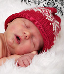 Knitted baby hat; Malabrigo Silky Merino Yarn, color 611 ravelry red