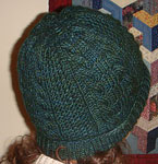 handknit cabled cap, hat; Malabrigo Worsted Merino Yarn color VAA #51