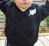 handknit child's sweater;
