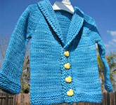 handknit long sleeve shawl collar child's cardigan; Malabrigo Merino Worsted Yarn color bobby blue