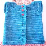handknit sleeveless child's cardigan vest; Malabrigo Merino Worsted Yarn color bobby blue