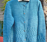 handknit long sleeve cabled crew neck cardigan; Malabrigo Merino Worsted Yarn color bobby blue