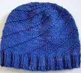 handknit swirly hat, cap; Malabrigo Worsted Merino Yarn color indigo 88