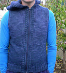 handknit vest with hood and zipper;