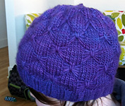 handknit hat, cloche free knitting pattern shown in Malabrigo Worsted Yarn, color purple magic #609