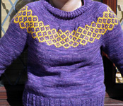 Crew neck pullover handknit sweater shown in Malabrigo Worsted Yarn, color purple magic #609
