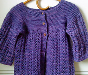 February Lady Sweater, handknit cardigan, free knitting pattern shown in Malabrigo Worsted Yarn, color purple magic #609