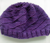 Hurricane Hat free knitting pattern; Malabrigo Worsted Yarn, color purple magic #609