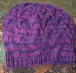 Star Crossed Slouchy Beret free kitting pattern shown in Malabrigo Worsted Yarn, color purple magic #609