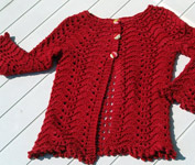 Malabrigo Worsted Merino Yarn, color ravelry red #611,  lace cardigan