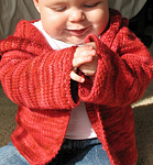 Malabrigo merino Worsted Yarn, color sealing wax 102, hooded baby sweater