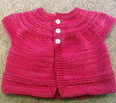 baby sweater; Malabrigo merino Worsted Yarn, color shocking pink #184