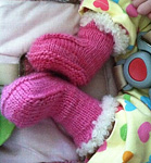 Malabrigo merino Worsted Yarn, color 184 shocking pink, baby booties