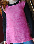 knitted Girl's dress; Malabrigo merino Worsted Yarn, color shocking pink #184