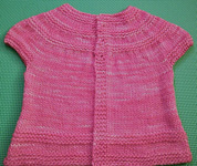 baby dress; Malabrigo merino Worsted Yarn, color shocking pink #184