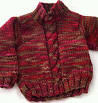 handknit pullover cabled child's sweater;