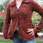 handknit cabled cardigan sweater; Malabrigo Merino Worsted Yarn color stonechat