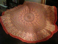 knitted blanket with color apricot; Malabrigo Worsted Yarn, color #152 tiger lily