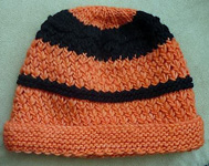 knitted 2-color hat, cap  free knitting pattern; Malabrigo Worsted Yarn, color #152 tiger lily
