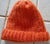 ribbed hat; cap free knitting pattern; Malabrigo Worsted Yarn, color #152 tiger lily