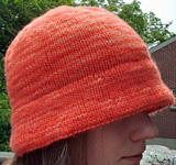 brimmed hat; cap free knitting pattern; Malabrigo Worsted Yarn, color #152 tiger lily