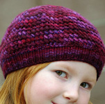 Malabrigo Worsted Yarn, color 204 velvet grapes, knitted child's beret