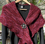 Malabrigo Worsted Yarn, color 204 velvet grapes, lacey shawl