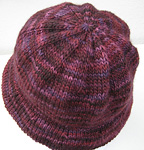 Malabrigo Worsted Yarn, color 204 velvet grapes, knitted hat