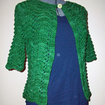 Liesl handknit cardigan by Ysolda Teague shown in Malabrigo merino Worsted Yarn, color 117 verde adriana