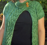 Asymmetrical Cabled Cardi free knitting pattern in Malabrigo merino Worsted Yarn, color 117 verde adriana