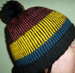 Malabrigo Silkpaca Yarn knit striped black and pogada and frank ochre hat