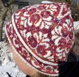 Hand-knit fair isle flowered hat with Malabrigo merino Sock Yarn color archangel