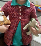 Hand-knit child's Cardigan Sweater with Malabrigo merino Sock Yarn color archangel