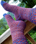 Hand-knit fair isle socks with Malabrigo Merino Sock Yarn color botticelli red and azules