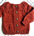 Hand-knit cabled cardigan sweater with Malabrigo Merino Sock Yarn color botticelli red