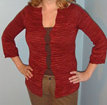 Hand-knit scalloped cardigan sweater with Malabrigo Merino Sock Yarn color botticelli red