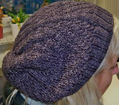 Hand knitted tam hat using Malabrigo Sock Yarn color eggplant