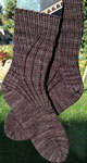 Hand knitted socks using Malabrigo Sock Yarn color eggplant