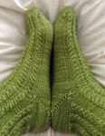 Hand-knit cabled socks with Malabrigo Merino Sock Yarn color lettuce