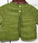 Hand-knit child's cardigan sweater with Malabrigo Merino Sock Yarn color lettuce