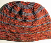 Hand-knit striped hat/tam with Malabrigo Merino Sock Yarn color marte and eggplant