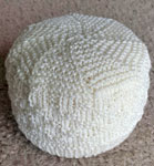 Malabrigo Merino Sock Yarn color natural hand-knitted baby hat